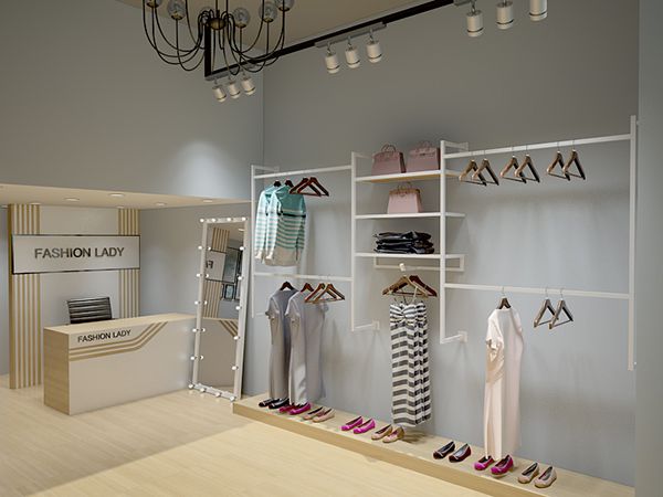 Giá treo sản phẩm được gắn trực tiếp trên tường là cách thiết kế shop thời trang nữ có mặt bằng nhỏ