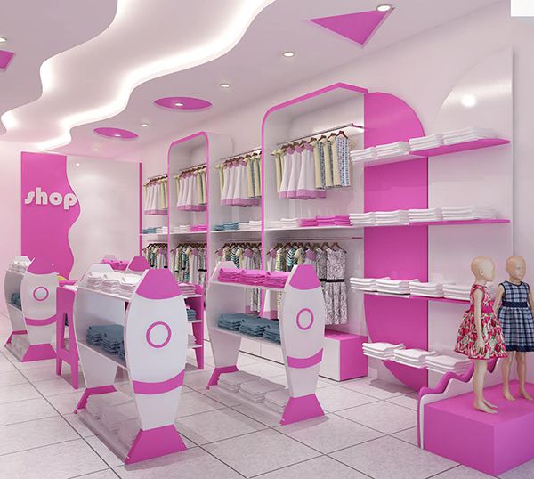 Màu hồng nổi bật trên nền trăng tạo sự nhẹ nhàng trong không gian shop, một ưu điểm của mẫu thiết kế nội thất shop thời trang trẻ em